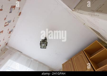 Anapa, Russia - June 25, 2020: View of the old ceiling in need of repair in the kitchen Stock Photo