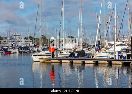 The Isle of Wight Ferry and fishing boats in Lymington Harbour, Hampshire, England Stock Photo