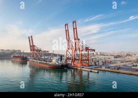 Salalah, Oman - November 19, 2019: Bulk Carrier vessels moored in Port of Salalah in Oman, Arabian Sea. Loading and unloading, export-import. Stock Photo