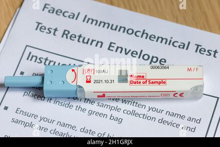 UK - April 21, 2021. Closeup of FIT test (faecal immunochemical test), a fecal occult blood test for screening bowel cancer Stock Photo
