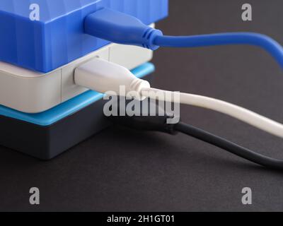 A stack of hard drives. Black background. Close up. Stock Photo