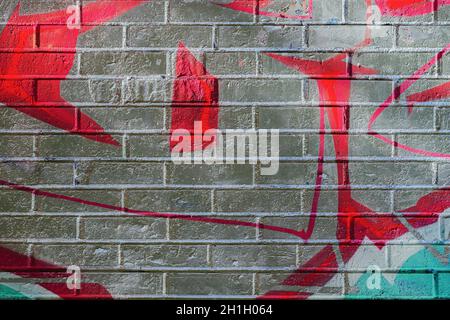 Abstract drawn colorful scribble on gray brick wall, abstract background and texture Stock Photo