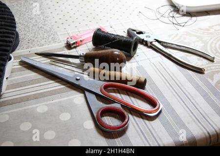 Shoemaker crafting tools set on table Stock Photo