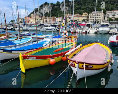 Nice, France - August 18, 2020: Small Colorful Wooden Fishing Boats Moored In The Old Port Of Nice, French Riviera, France, Europe Stock Photo