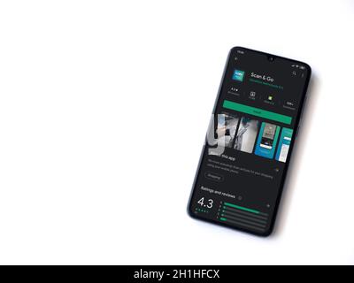 Lod, Israel - July 8, 2020: Scan & Go app play store page on the display of  a black mobile smartphone on wooden background. Top view flat lay with cop  Stock Photo - Alamy