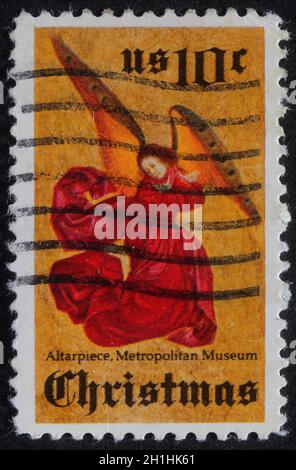 Christmas stamp printed in USA showing angel, circa 1980 Stock Photo
