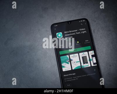 Lod, Israel - July 8, 2020: Mint Browser app play store page on the display of a black mobile smartphone on dark marble stone background. Top view fla Stock Photo