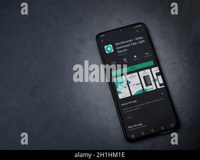Lod, Israel - July 8, 2020: Mint Browser app play store page on the display of a black mobile smartphone on dark marble stone background. Top view fla Stock Photo