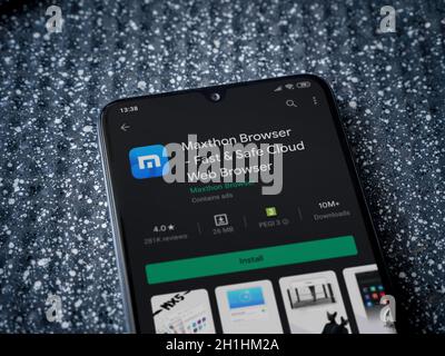 Lod, Israel - July 8, 2020: Maxthon Browser app play store page on the display of a black mobile smartphone on a metallic background. Close up top vie Stock Photo