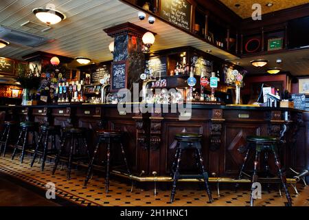 LONDON - April 26: Interior of pub, for drinking and socializing, focal point of the community, on April 26, 2017, London, UK. Pub business, now about Stock Photo