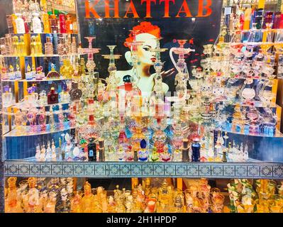 Sharm El Sheikh, Egypt - February 17, 2020: The arabian sale in store with colorful bottles with healing oils on shelfs Stock Photo