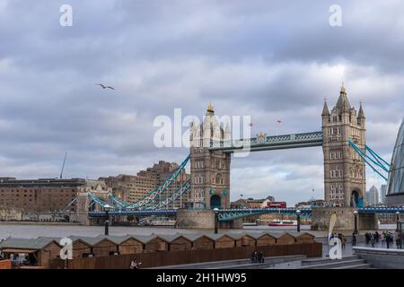 London, UK - December 13 2020: Unidentified people around Tower bridge over the River Thames Stock Photo