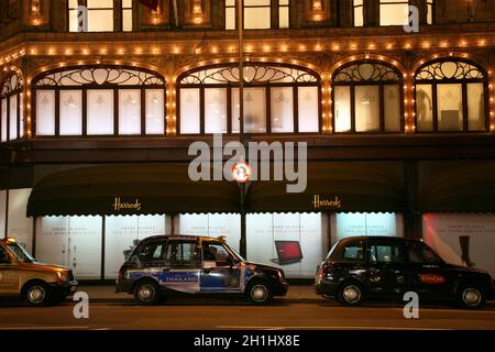 London, UK - January 11, 2011 : Night View of Harrods department store in the Brompton Road, near Knightsbridge Tube Station. This department store wa Stock Photo