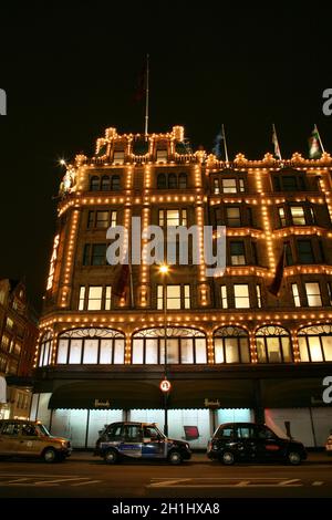 London, UK - January 11, 2011 : Night View of Harrods department store in the Brompton Road, near Knightsbridge Tube Station. This department store wa Stock Photo