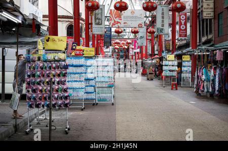 Kuala Lumpur, Malaysia. 18th Oct, 2021. A man seen shopping protective face masks at a store near an empty Chinatown shopping area in Kuala Lumpur. (Photo by Wong Fok Loy/SOPA Images/Sipa USA) Credit: Sipa USA/Alamy Live News Stock Photo