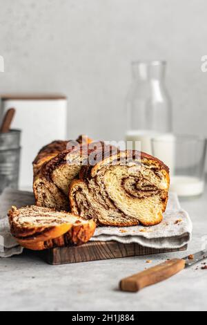 Home made Chocolate Babka laying on wooden board Stock Photo