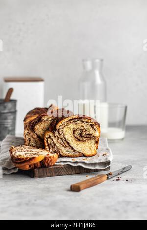 Home made Chocolate Babka laying on wooden board Stock Photo