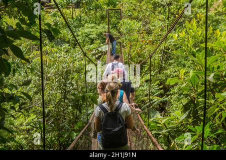 Bocas Del Toro, Panama: August 23, 2019: Tourists at an old hanging bridge in the jungle of Panama Stock Photo