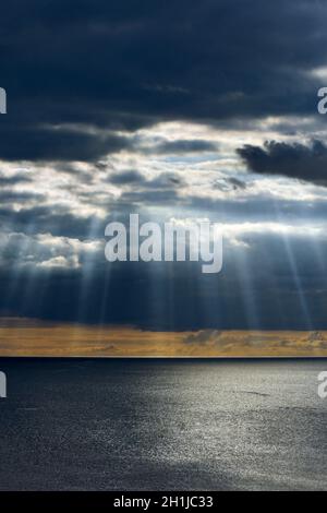 Stunning sunrays breaking through storm clouds in South Devon Stock Photo