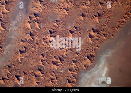 A view of Earth from the International Space Station: Saharan sand Dunes, the Sahara desert. An optimised and digitally enhanced version of a NASA/ ESA image. Mandatory Credit: NASA/ESA/T. Pesquet. NB: Usage restrictions: Not to be presented as an endorsement. Stock Photo
