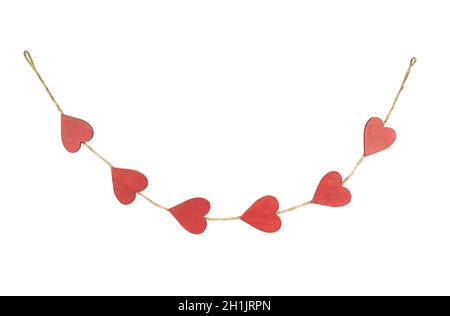 Hanging rustic garland from red wooden hearts isolated on white background. Stock Photo