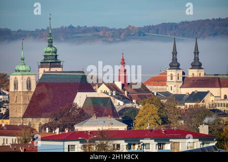 view of the city of Jihlava with Church of St. James the Greater. Autumn fall season with mist. Vysocina, Czech Republic Stock Photo