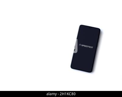 Lod, Israel - July 8, 2020: Speedtest app launch screen with logo on the display of a black mobile smartphone isolated on white background. Top view f Stock Photo