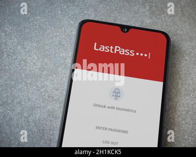 Lod, Israel - July 8, 2020: LastPass Password Manager app launch screen with logo on the display of a black mobile smartphone on ceramic stone backgro Stock Photo