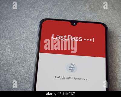 Lod, Israel - July 8, 2020: LastPass Password Manager app launch screen with logo on the display of a black mobile smartphone on ceramic stone backgro Stock Photo