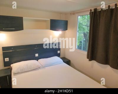 Bardolino, Italy - September 19, 2014: The inside view of house at camping site La Rocca in the morning light at Bardolino, Italy on September 19, 201 Stock Photo