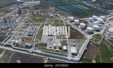 Oil refinery plant for primary and deep oil refining. Equipment and tanks in the oil refinery. Rectification and vacuum equipment Stock Photo