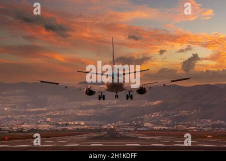 big plane landing at Osaka-Itami International Airport during sunset, Japan Stock Photo