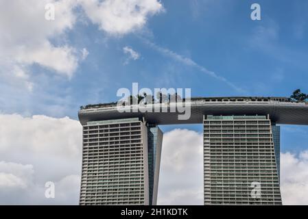 Singapore - December 4, 2019: Detail of modern skyscraper building in Marina bay sands, abstract architectures and cloudy sky in Singapore. Stock Photo