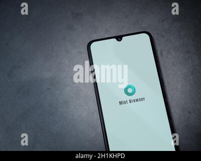 Lod, Israel - July 8, 2020: Mint Browser app launch screen with logo on the display of a black mobile smartphone on dark marble stone background. Top Stock Photo
