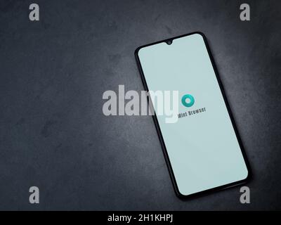 Lod, Israel - July 8, 2020: Mint Browser app launch screen with logo on the display of a black mobile smartphone on dark marble stone background. Top Stock Photo