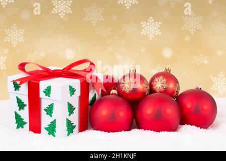 Christmas card gift present gold decoration gifts winter snow snowing balls surprise Stock Photo