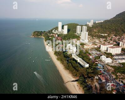 Teluk Bahang, Penang/Malaysia - Mar 08 2020: Aerial view boat sail at Batu Feringghi beach. Stock Photo