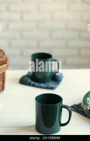 Green plastic kitchenware on a table close up Stock Photo