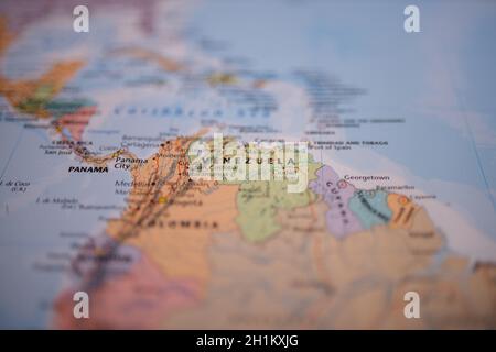 Venezuela on a map of South America with its main roads marked in red and the rest of the countries blurred out Stock Photo