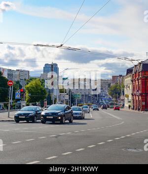MINSK, BELARUS - JULY 17, 2019: Central street with car traffic and modern architecture in evening sunlight Stock Photo