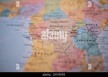 Close up picture of the Democratic Republic of the Congo with its main routes in red, and on a colorful map of Africa with the rest of the countries b Stock Photo