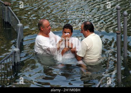 Baptismal site at Jordan river shore. Baptism of pilgrims  in Yardenit, Israel. Stock Photo