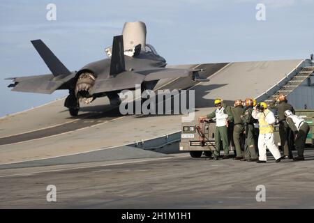 Bay of Bengal, India. 17th Oct, 2021. A Royal Air Force F-35B Lightning II stealth fighter jet with the RAF 617 Squadron, launches from the flight deck of the Royal Navy Fleet Flagship HMS Queen Elizabeth during Carrier Integration Operations with the U.S. Navy October 17, 2021 in the Bay of Bengal, India. Credit: Unaisi Luke/U.S. Marine Corps/Alamy Live News Stock Photo