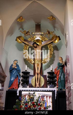 LJUBLJANA, SLOVENIA - JUNE 30: Virgin Mary and St. John under the cross, altar in the St Nicholas Cathedral in Ljubljana, Slovenia on June 30, 2015 Stock Photo