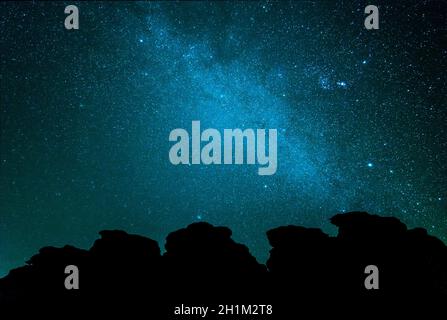 Milky way over rocks in wadi rum at night Stock Photo