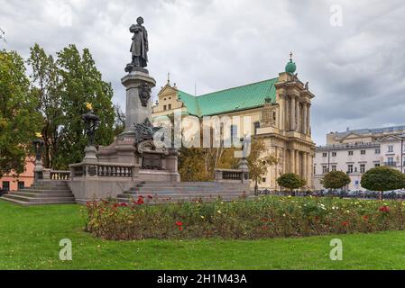 Statue of Adam Mickiewicz and Visitationist Church in Warsaw Stock Photo