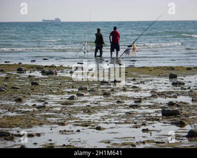 Fishermen on the shore of the Caspian Sea. Kazakhstan. 16 September 2019 year. Mangistau region. Stock Photo