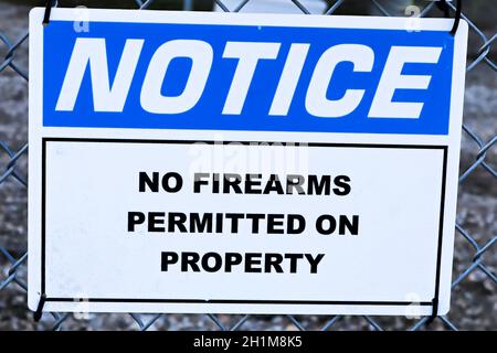 A Notice, No Firearms Permitted on Property sign. Stock Photo