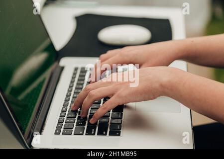 Close-Up Shot of Human Hands Placed Over Laptop. Stock Photo