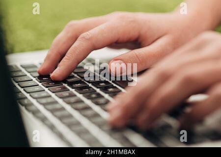 Close-Up Shot of Human Hands Placed Over Laptop. Stock Photo